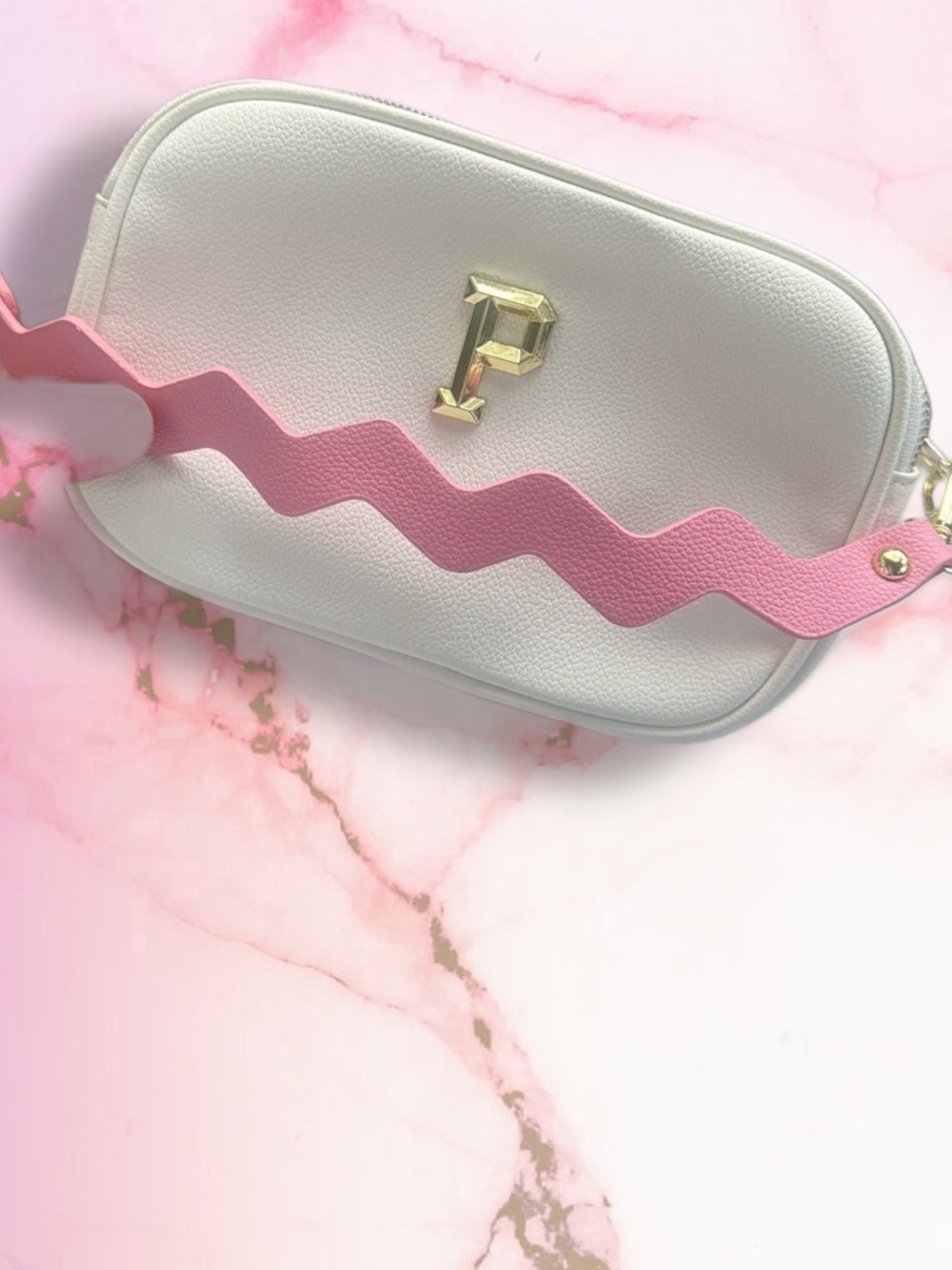 White Crossbody Bag with Pink Zigzag Strap and Gold 'P' Accent
